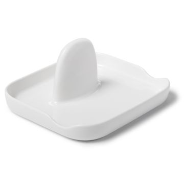 white ceramic spoon and lid rest